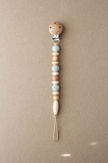 Speckled Soft Sage Pacifier Clip - Omar, perfect for keeping pacifiers clean and accessible for your baby.
