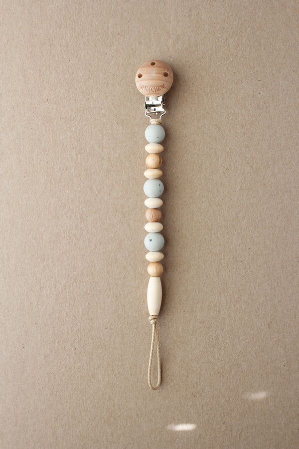 Speckled Soft Sage Pacifier Clip - Omar, perfect for keeping pacifiers clean and accessible for your baby.
