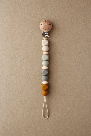 Pacifier Clip - Robin | Ginger, a stylish and functional pacifier holder for babies.