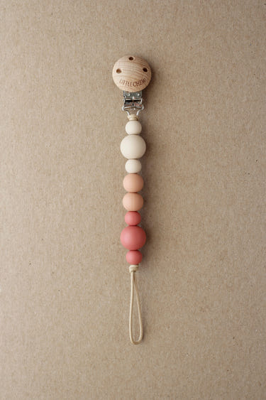 Maroon Kira pacifier clip for babies, stylish and functional accessory to keep pacifiers close and clean.