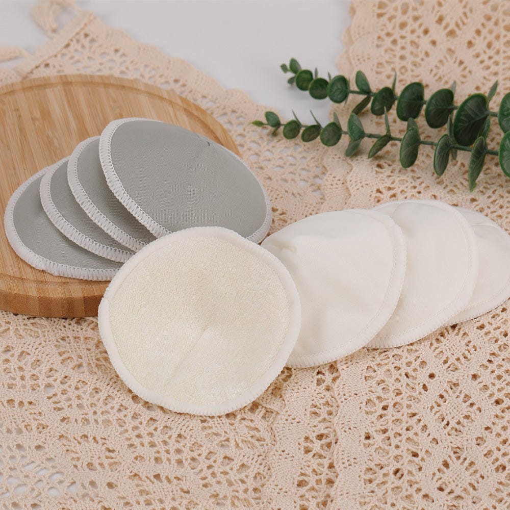 Haakaa All-Day Reusable Nursing Pad Set, 8 Ct with Washing Bag for breastfeeding comfort and convenience.