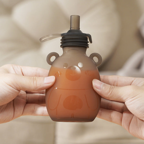 Haakaa Happii Bear Silicone Goody Pouch 6 oz for baby feeding utensils, shown from angle 3.
