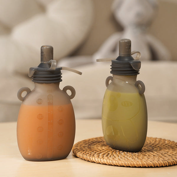 Haakaa Happii Bear Silicone Goody Pouch 6 oz for baby feeding utensils, shown at angle 8.