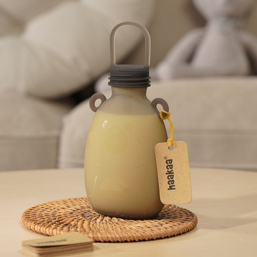 Haakaa Happii Bear Silicone Milk Storage Bag 9oz for convenient breast milk storage and feeding.
