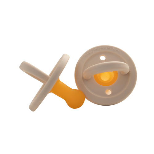 Modern ivory pacifier for babies, designed for comfort and style. Perfect for soothing your little one.