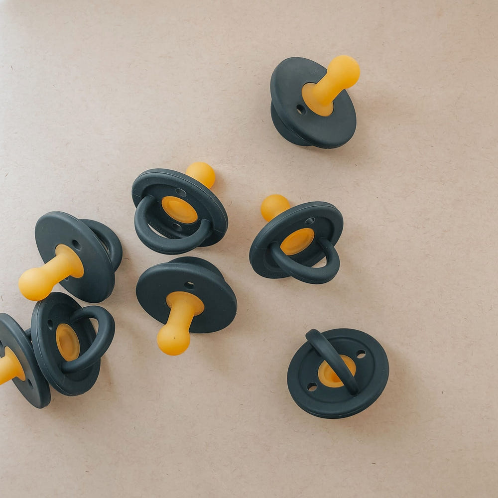 Modern navy pacifier for babies, designed for comfort and style. Perfect for soothing infants.