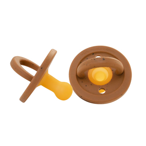 Modern speckled almond pacifier for babies, designed for comfort and style.