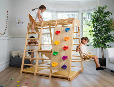 Magnolia Jungle Gym: Stylish indoor playset for babies, promoting fun and safe exploration in a vibrant jungle theme.