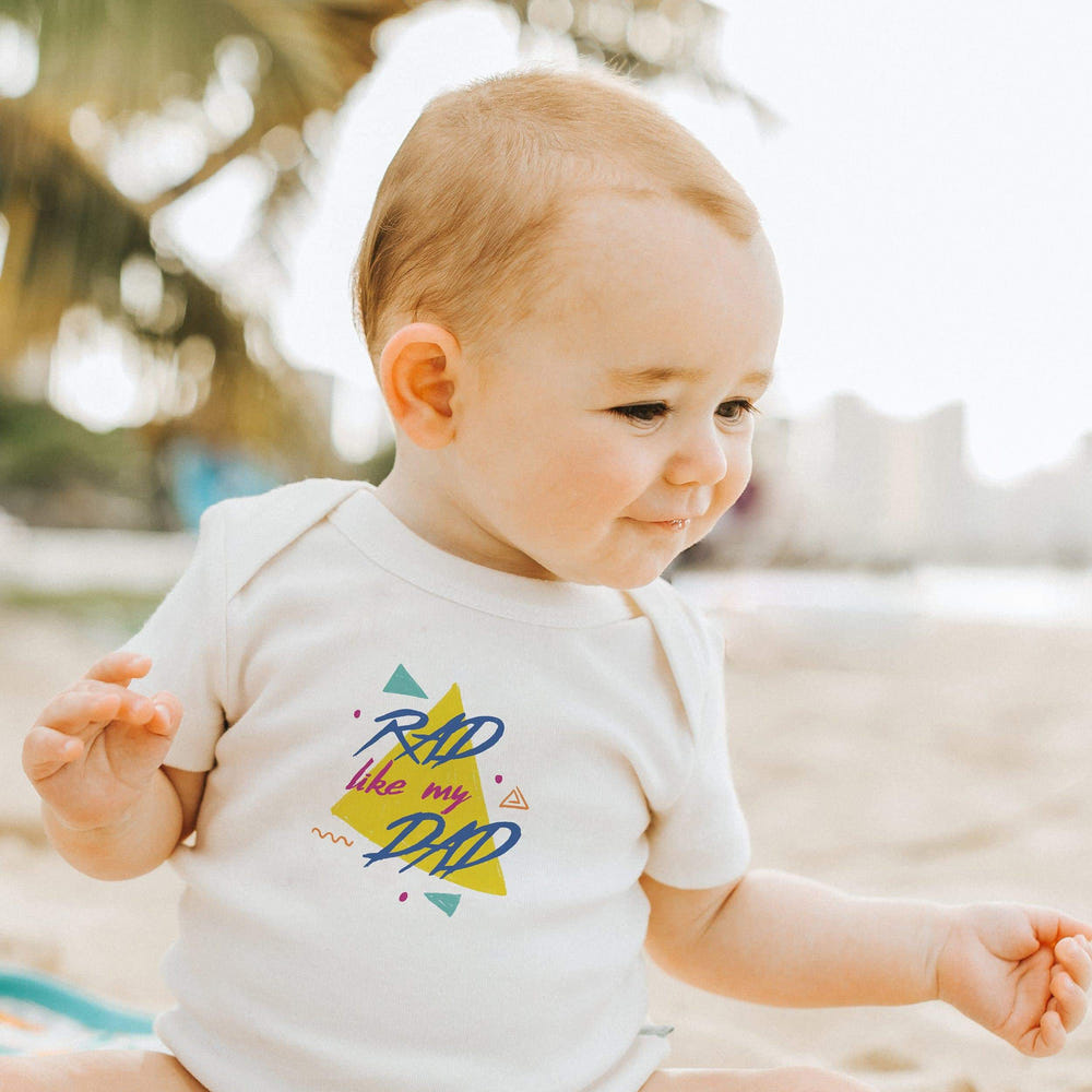 "Rad like my dad graphic short sleeve bodysuit for babies, stylish and fun baby clothing."