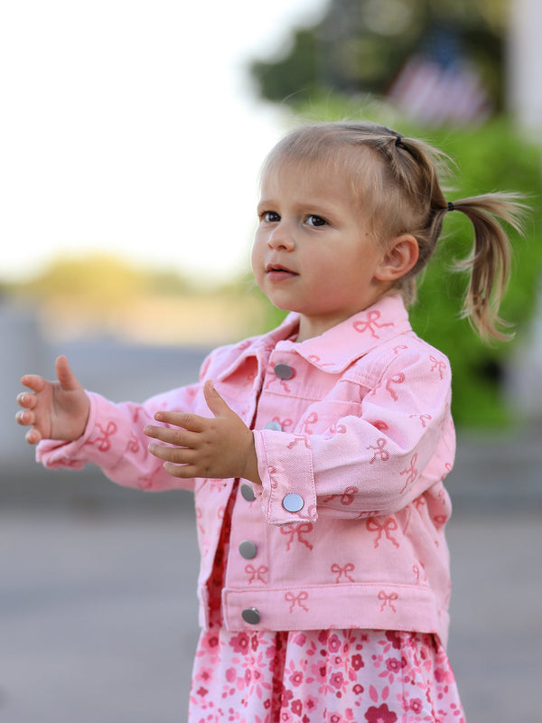 Pink fall girls' butterfly print denim top, angle view showcasing stylish design and vibrant colors.