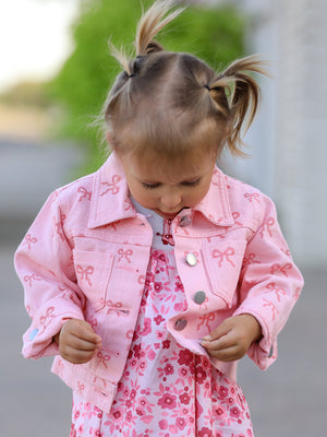 Pink fall girls' butterfly print denim top, angle view showcasing stylish design and vibrant colors.
