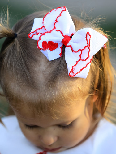 Valentine’s Hair Bow - White Ribbon with Red Heart Embroidery for babies, perfect for festive occasions.
