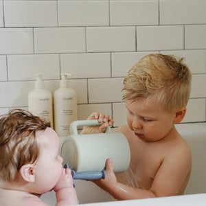 Colorful bath rinse cup for babies, angled view showcasing its ergonomic design and easy grip for bath time fun.