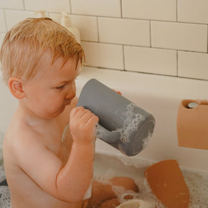 Colorful bath rinse cup for babies, designed for easy rinsing at bath time, shown from angle 21.