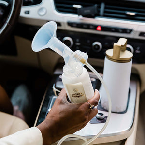 Set of 2 glass breast milk bottles at angle 13, perfect for safe and stylish milk storage.