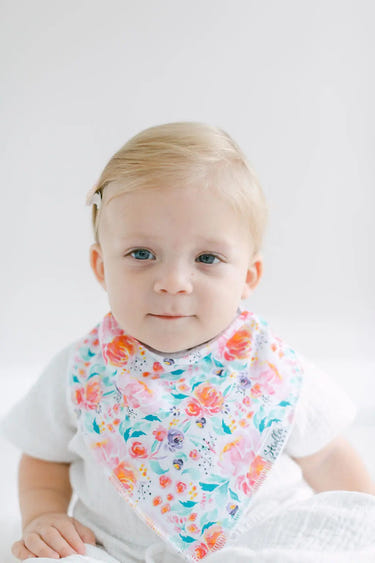 Colorful bandana bibs featuring flowers, hearts, and bows for stylish baby feeding and drooling protection.