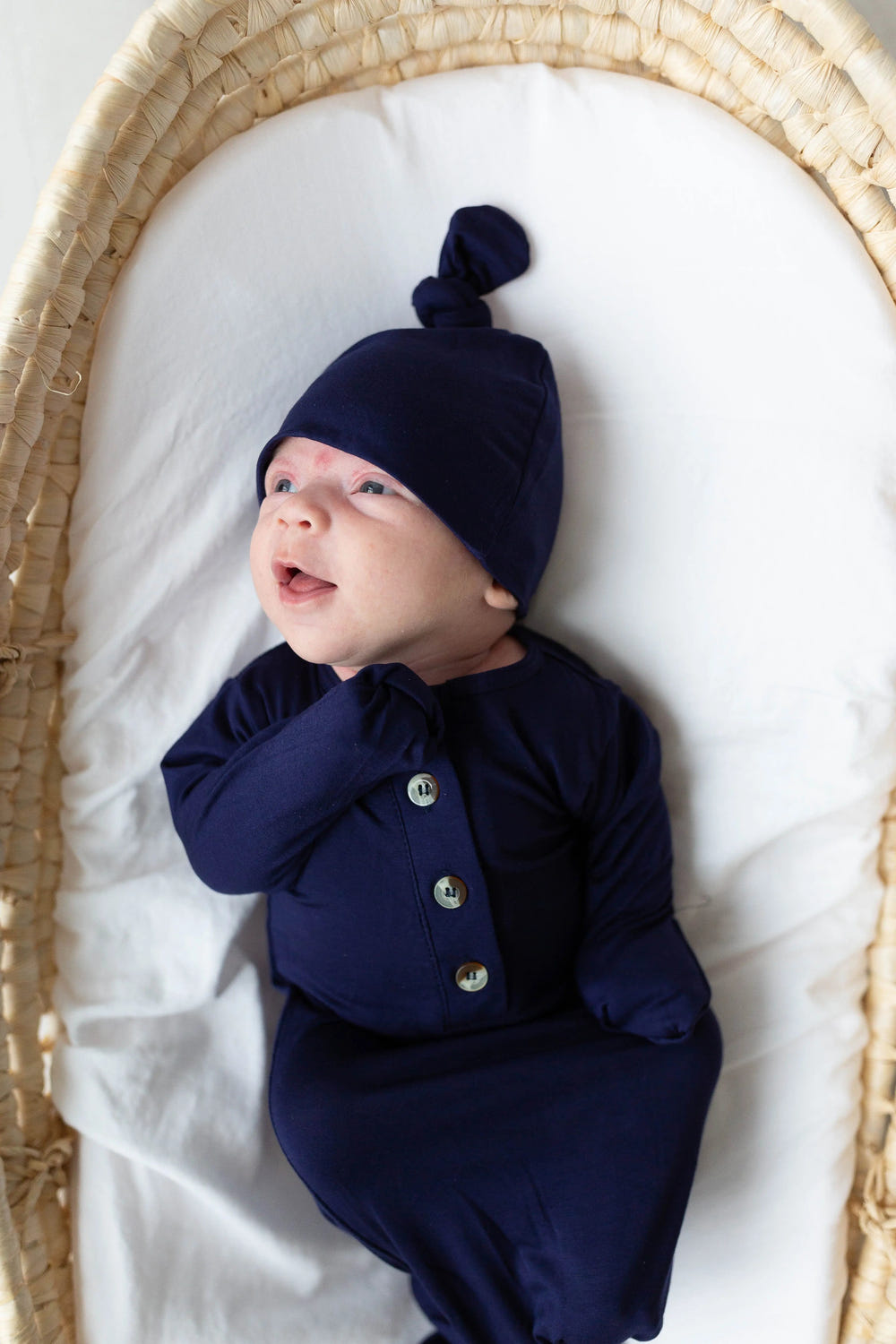 Navy blue newborn knotted gown and hat set for boys, perfect for stylish and comfortable baby outfits.