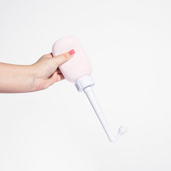 "Peri bottle for postpartum wellness, angled view showcasing ergonomic design and easy grip."