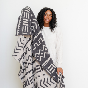 Double-layer Bamboni® throw blanket for babies, soft and cozy, perfect for swaddling and keeping warm. Angle 3 view.