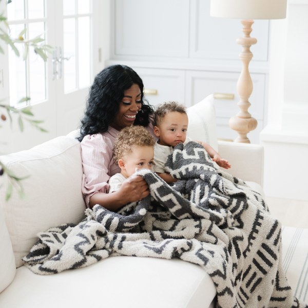 Cozy DOUBLE-LAYER BAMBONI® throw blankets for babies, perfect for swaddling and keeping warm.