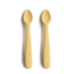 Silicone feeding spoons for babies, angled view showcasing soft, safe design for easy feeding.