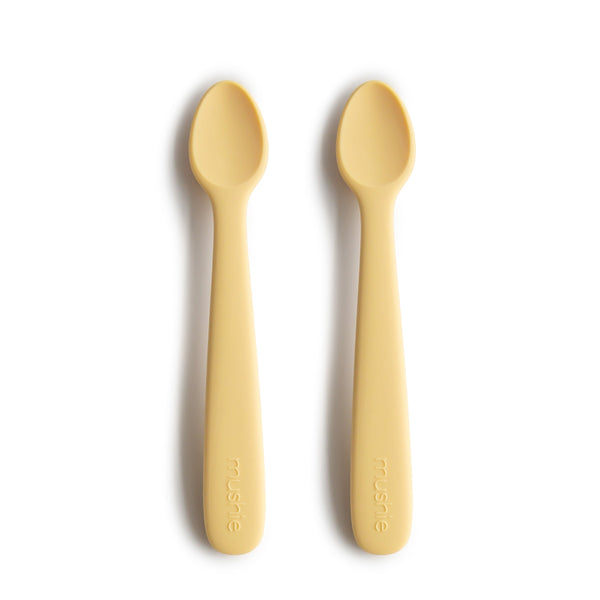 Silicone feeding spoons for babies, angled view showcasing soft, safe design for easy feeding.