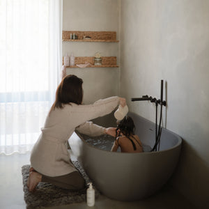 Colorful bath rinse cup for babies, perfect for gentle rinsing during bath time. Angle 14 view.