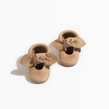 Newborn weathered brown knotted bow baby shoe, perfect for stylish little feet.