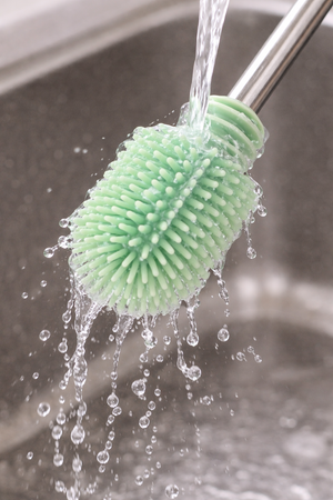Haakaa Double-Ended Silicone Brush for bottle cleaning, shown from angle 13, perfect for baby care essentials.