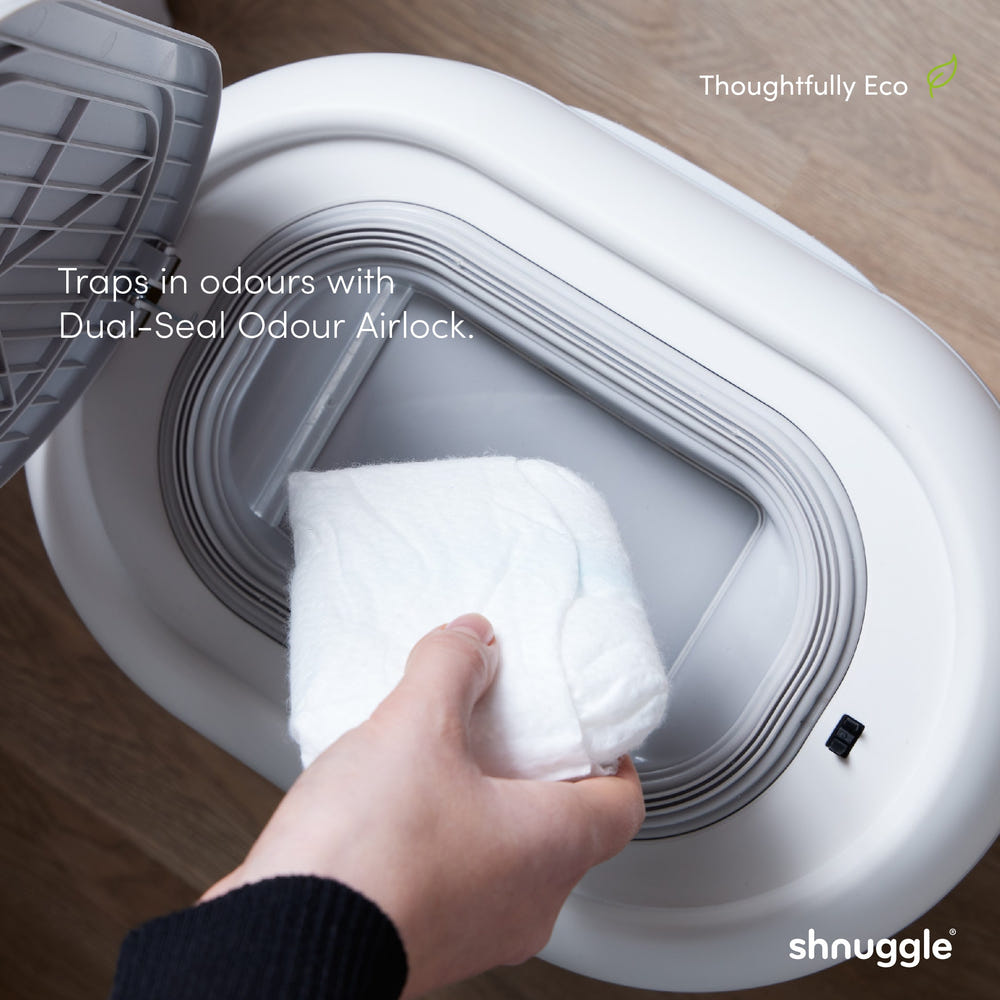 Shnuggle Changing Essentials Kit: Mat, Diaper Pail, and Liners for hassle-free diaper changes.
