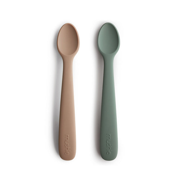 Silicone feeding spoons for babies, angled view showcasing soft, safe design for easy feeding.
