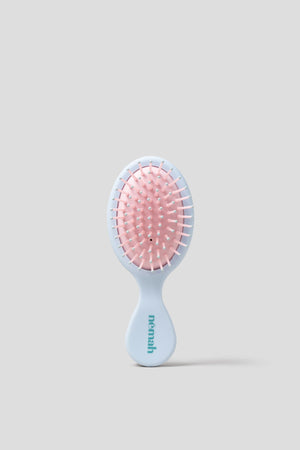 Kids detangling brush for easy hair care, perfect for toddlers and young children.