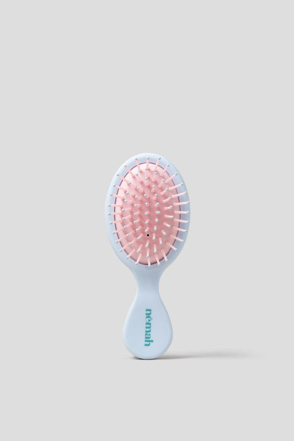 Kids detangling brush for easy hair care, perfect for toddlers and young children.