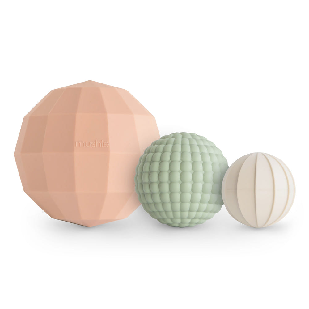 Nesting Spheres Sensory Toy for babies, colorful and engaging, perfect for developing fine motor skills and sensory exploration.