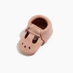 Blush Mary Jane baby shoe for newborns, stylish and comfortable, shown from angle 2. Perfect for little feet!