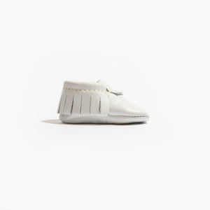 Newborn bright white moccasin baby shoe, angle 3 view, perfect for stylish infant footwear.