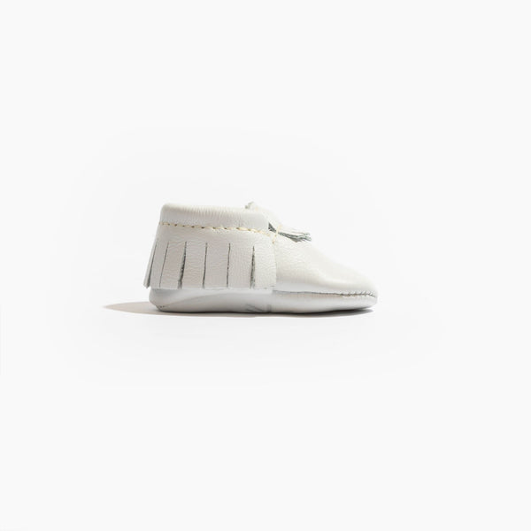 Newborn bright white moccasin baby shoe, angle 3 view, perfect for stylish infant footwear.