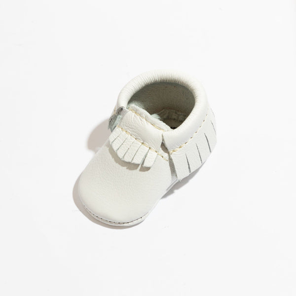 Newborn bright white moccasin baby shoe, angle 2, perfect for stylish infant footwear.
