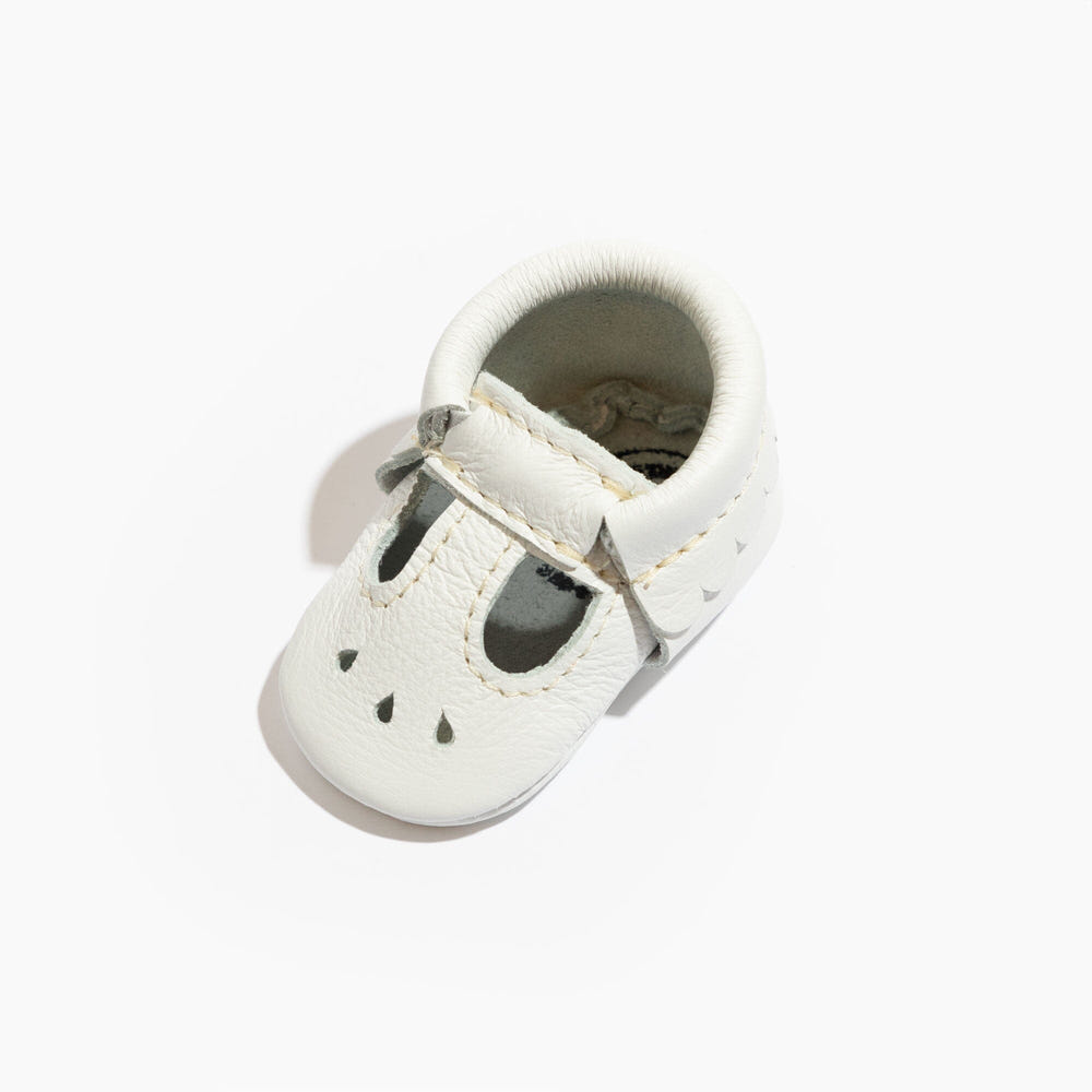 Newborn bright white Mary Jane baby shoes, perfect for stylish little feet.