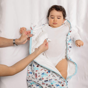 One & Done Sleep Sack in Transportation design, angled view showcasing cozy and safe sleep for babies.