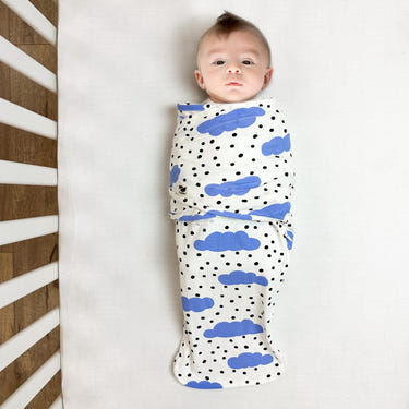 Snugababe Swaddle™ Sleep Pod in Blue Clouds for comfortable baby sleep, perfect for newborns and toddlers.