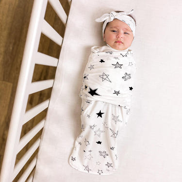 Snugababe Swaddle™ Sleep Pod in star design, perfect for cozy and safe baby sleep.