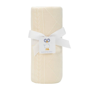 Soft oatmeal knit baby blanket, perfect for cozying up your little one.