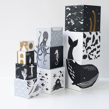 Colorful nesting blocks featuring ocean animals, perfect for baby's playtime and development.