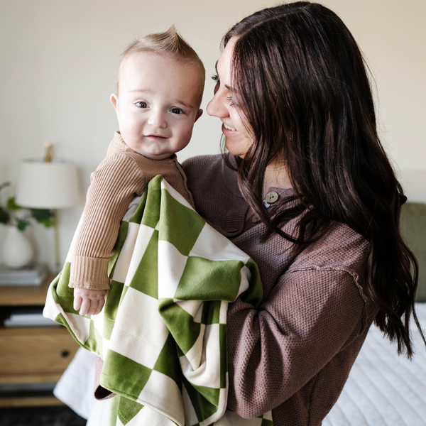 Minky stretch receiving blankets in soft colors, perfect for swaddling and keeping your baby cozy.