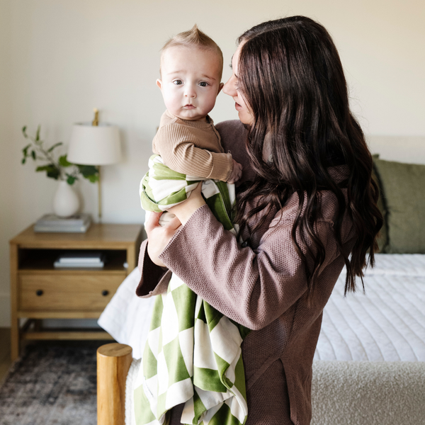 Minky stretch receiving blankets in soft colors, perfect for swaddling and keeping your baby cozy.