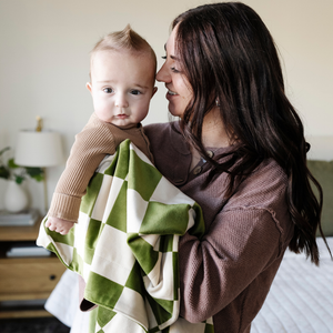 Soft Minky stretch receiving blankets in various colors, perfect for swaddling and keeping your baby cozy.