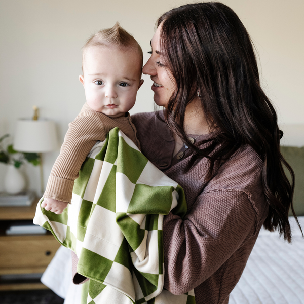 Soft Minky stretch receiving blankets in various colors, perfect for swaddling and keeping your baby cozy.