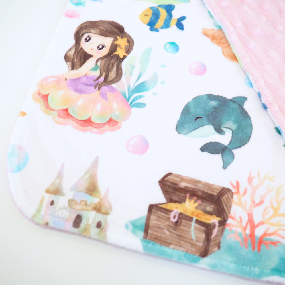 Mini Minky Blanket featuring colorful mermaids, perfect for keeping your baby cozy and stylish.