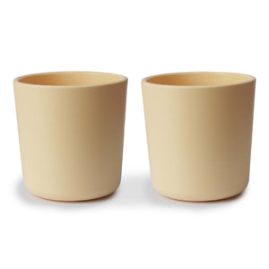 Colorful baby dinnerware cups displayed at an angle, perfect for mealtime fun and learning.